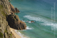 Pedn Vounder beach and the cliffs of Logan Rock, Treen, Cornwall