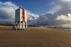 An old wooden lighthouse on the beach at Burnham-on-Sea, Somerset, Great Britain.