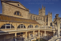 The main pool at the Roman Baths, with Bath Abbey behind, Bath, Great Britain.
