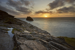 Sunset over the Atlantic, with silhouette of Meachard and the cliffs of Boscastle, Cornwall, Great Britain.