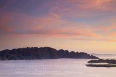 Dusk view across Coron Bay to Coron Island from the summit of Mt Tapyas, Coron Town, Busuanga, Calamian Islands, Palawan, Philippines.
