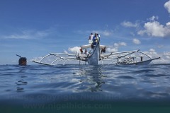 Banca coming in to pick up snorkellers after swimming with whale sharks, Donsol, Sorsogon, Luzon, Philippines.