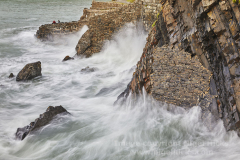 Surf on the quay at Hartland Quay, Devon, Great Britain.