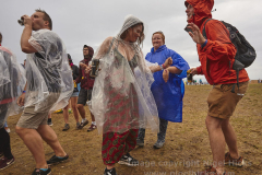 Coping with the rain. Boardmasters Music Festival, Newquay, Cornwall, Great Britain. 12 Aug 2018.