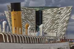 A view of the Titanic Museum, with the SS Nomadic, the only surviving White Star Line ship, in the Titanic Quarter, Belfast, Northern Ireland, UK.
