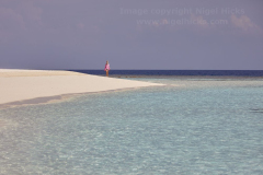 A white sand coral beach against azure sea, Havodda Island, in Gaafu Dhaalu atoll, in the far south of the Maldives, Indian Ocean.