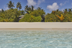 A white sand coral beach against azure sea, Havodda Island, in Gaafu Dhaalu atoll, in the far south of the Maldives, Indian Ocean.