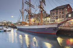A dusk view of Sutton Harbour, in the Barbican, Plymouth, Devon, Great Britain.