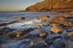 The Atlantic washing onto rocks at Cape Cornwall, near Penzance, Cornwall, Great Britain.