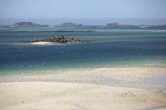 A low tide view across Pentle Bay, on Tresco, across to the Eastern Isles, Isles of Scilly, Great Britain.
