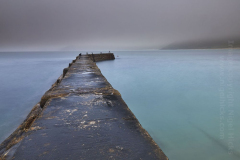 The breakwater at Sennen Cove at dawn; near Land